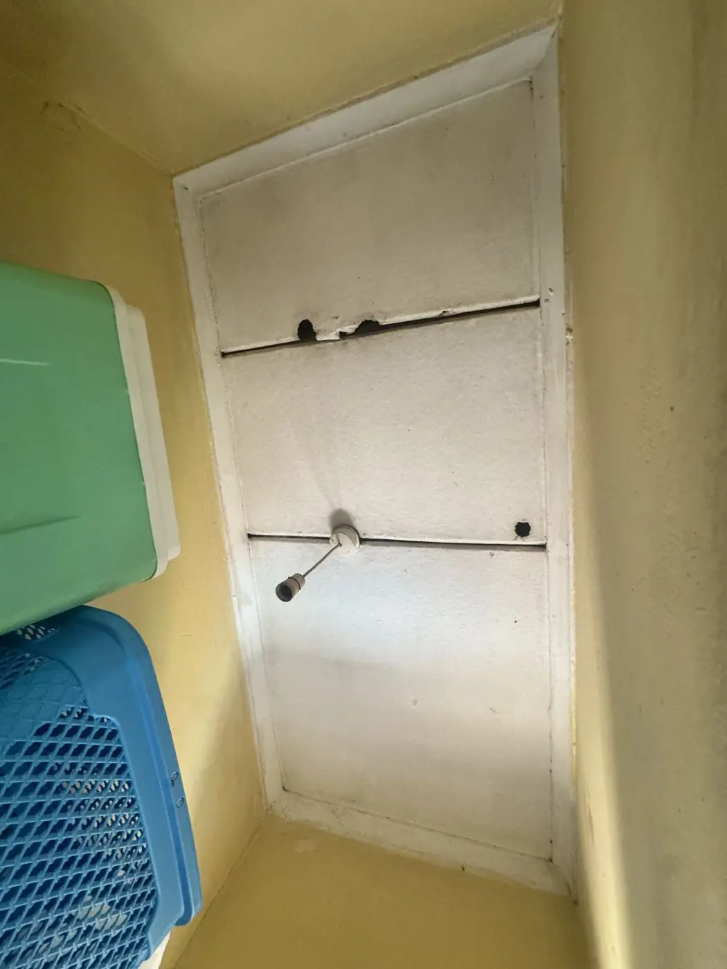 Damaged wall panel with broken fittings
